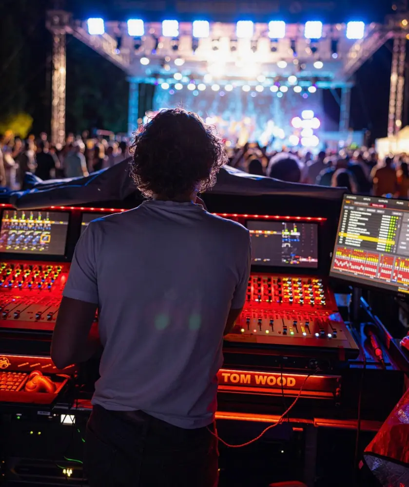 Tom mixing an outdoor festival stage at night